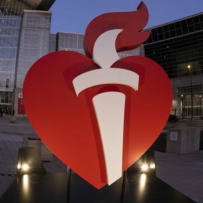 The AHA Heart and Torch logo on display outside the Scientific Sessions 2022 conference hall.