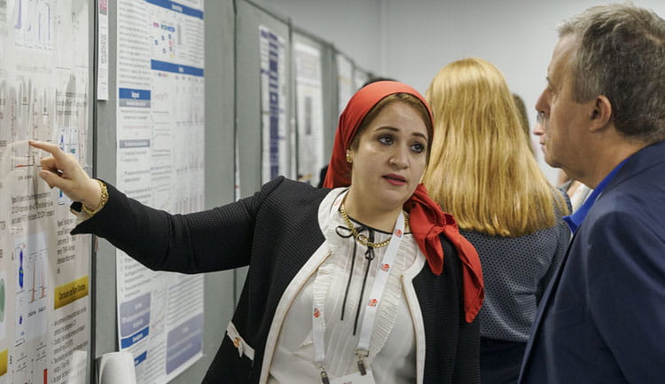A poster presenter discusses her science during Hypertension 2024.