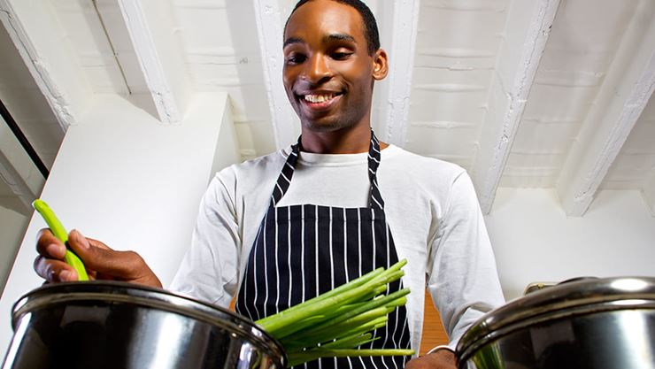 man cooking healthy