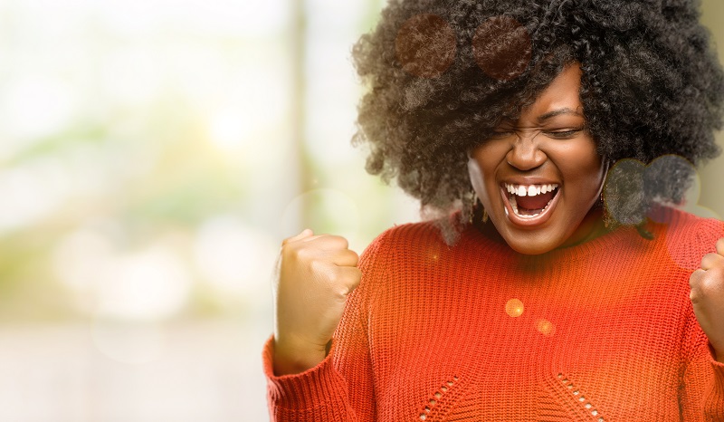 African American woman smiling and excited