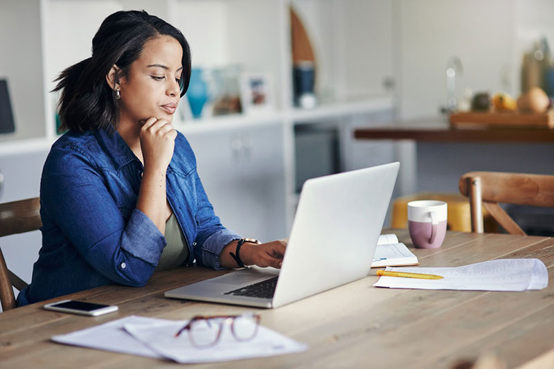 woman reading on laptop