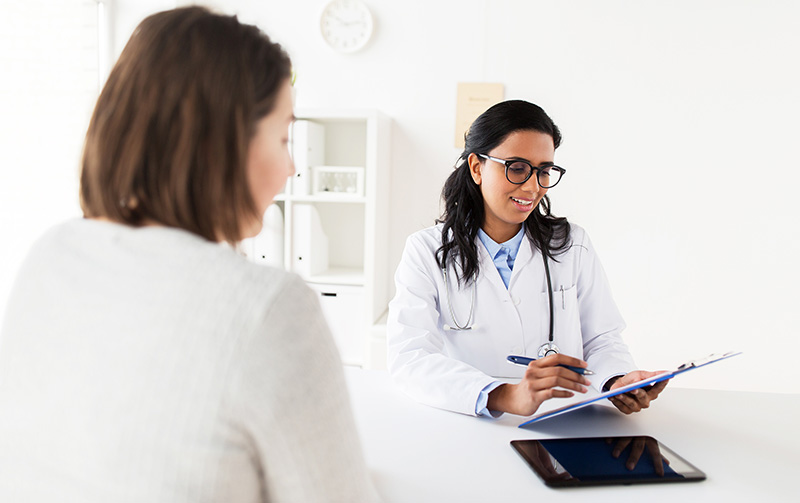 doctor reviewing chart with patient