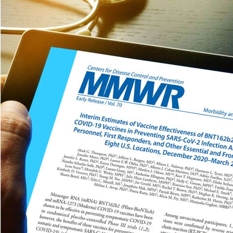 Healthcare professional looks at CDC's MMWR report on tablet.