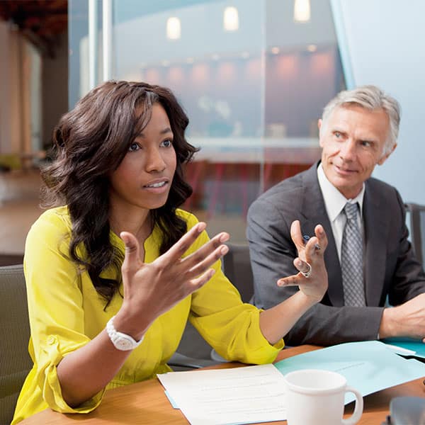 Business meeting with young black women and white older man