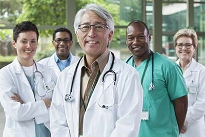 Group shot of five diverse healthcare providers