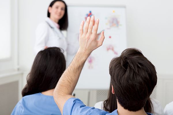 Doctor giving a medical presentation to other healthcare professionals