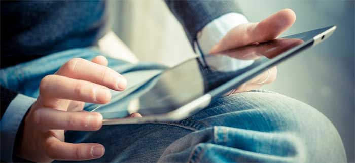 man holding tablet