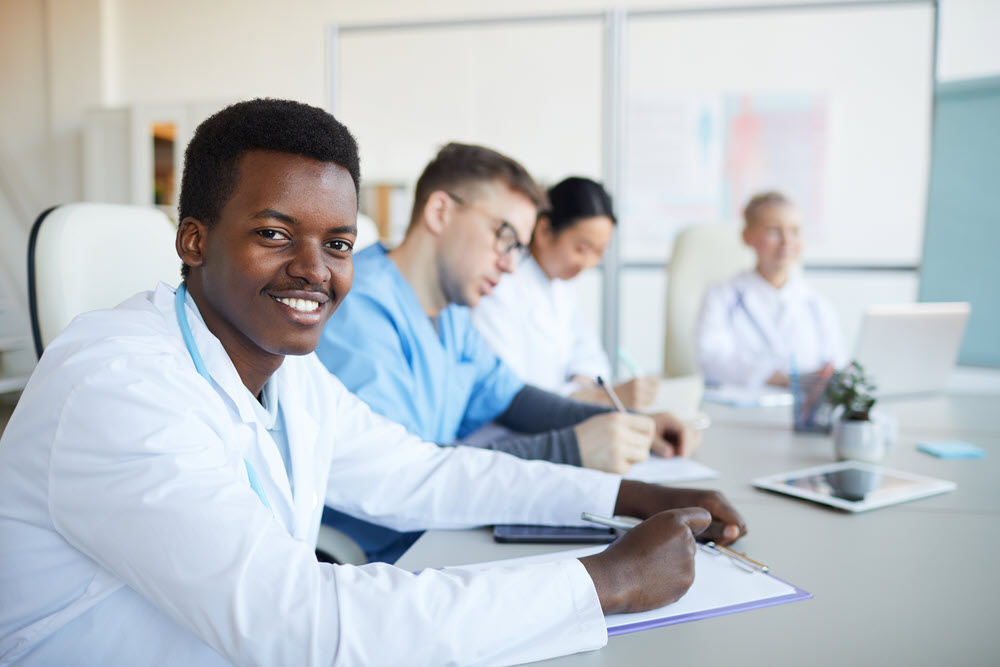 Young African doctor smiling in internship