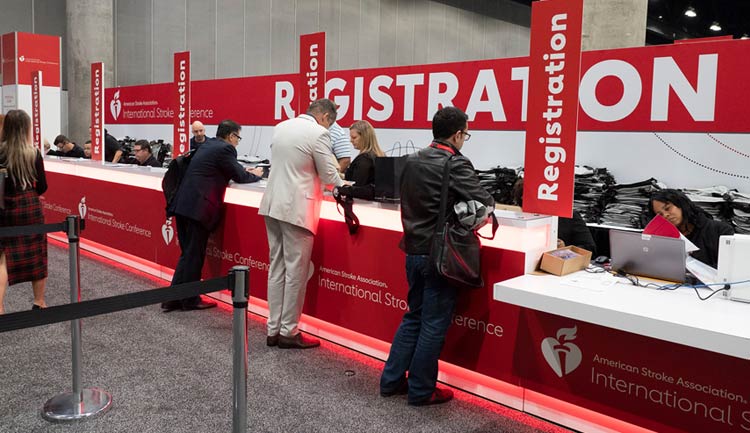 Attendees standing at the registration desk during the International Stroke Conference.