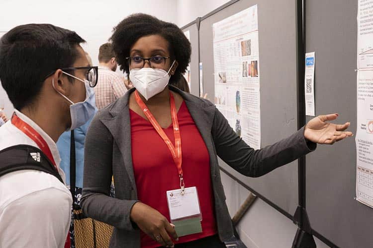 BCVS 2022 attendees discuss cardiovascular basic science during Poster Session I on Monday, July 25, 2022.
