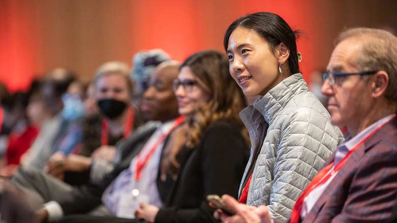 Audience members smile during a presentation at EPI|Lifestyle 2023 in Boston, MA. The conference was held February 28 – March 3, 2023.