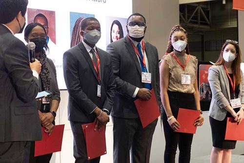 Award winners stand before an audience at the Stroke Council Underrepresented Racial and Ethnic Travel Grant and Bernard J Tyson Career Development Award presentations on Thursday, Feb. 10, 2022.