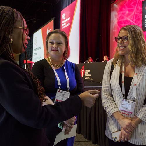 Three women discuss science during ISC 2024.