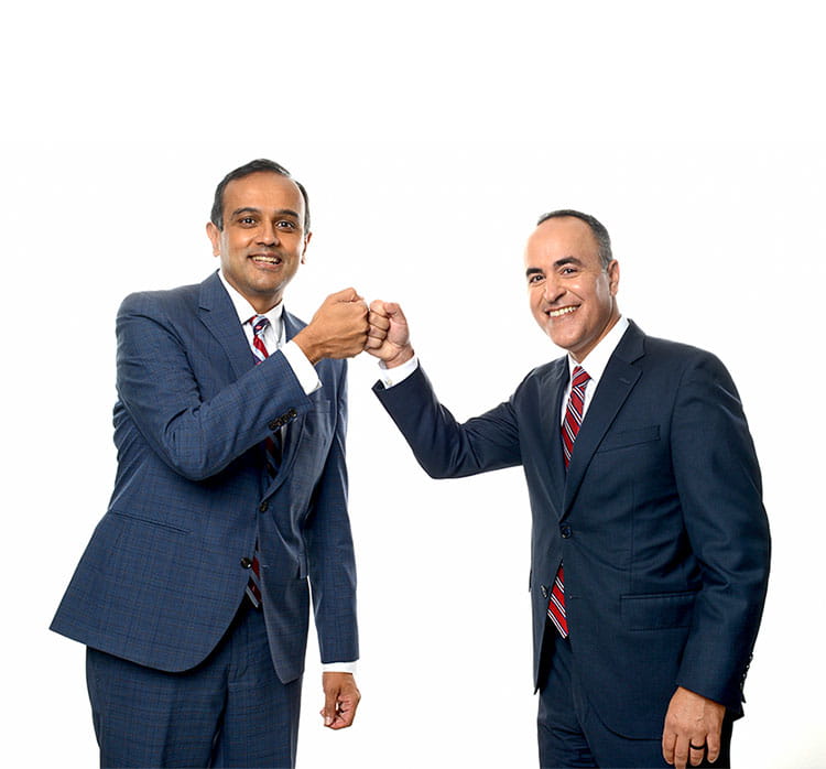 Manesh R. Patel, MD and Amit Khera, MD are photographed bumping fists.