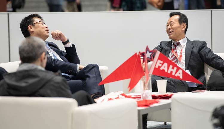 Two Fellows of the American Heart Association share a laugh in the exclusive FAHA Lounge.