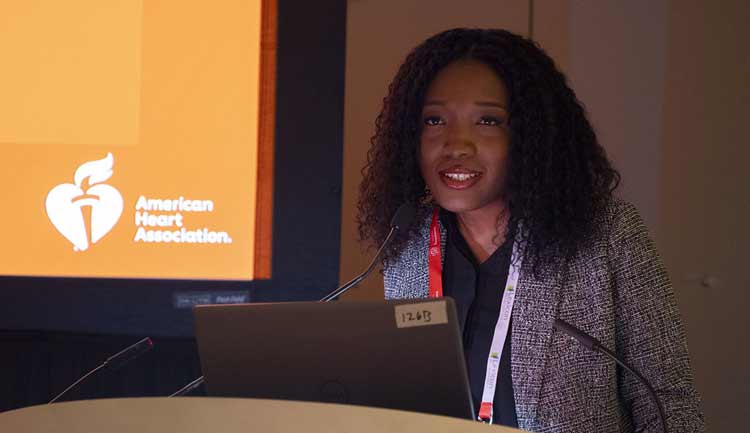 A scientist explains her presentation science to a room full of attendees during #AHA23 in Philadelphia.