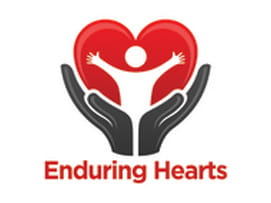 Image for enduring hearts. Logo showing open hands with child and a heart