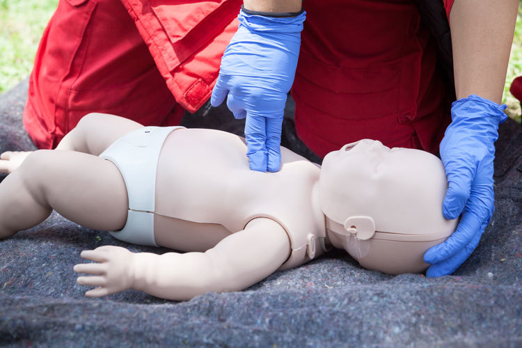 CPR training using an infant CPR dummy
