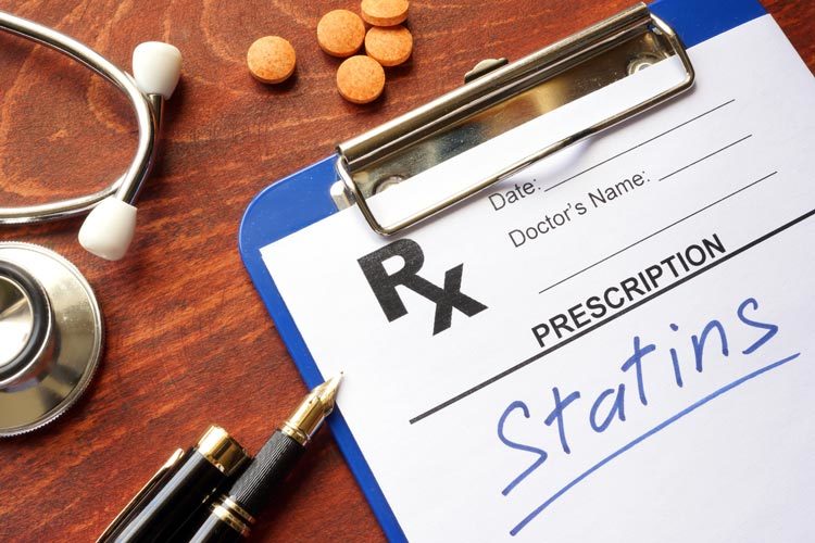 clipboard with statins written on prescription pad