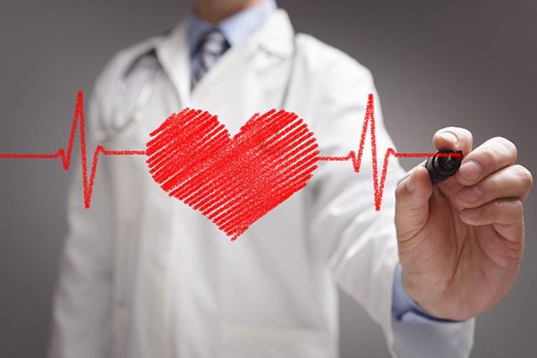 doctor drawing ecg heartbeat chart