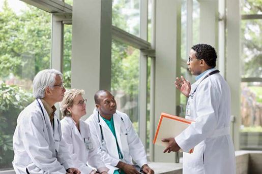 Doctors talking together in the lobby