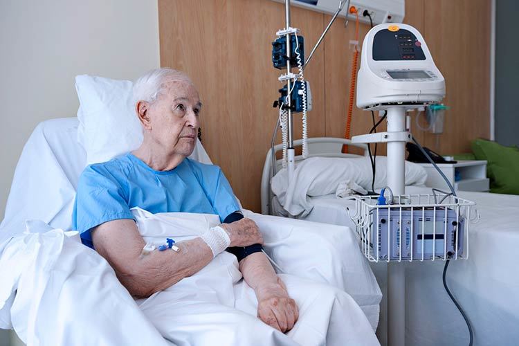 Elderly man residing in a hospital room