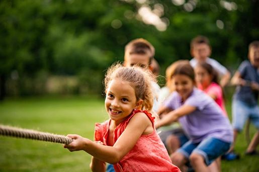 group of kids pulling a rope