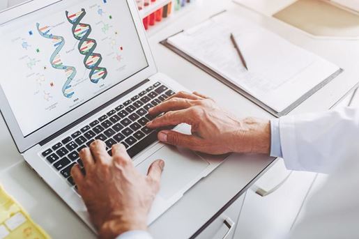 laboratory scientist working on a laptop