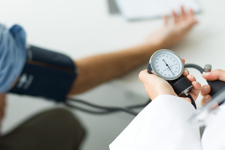 patient getting blood pressure measured