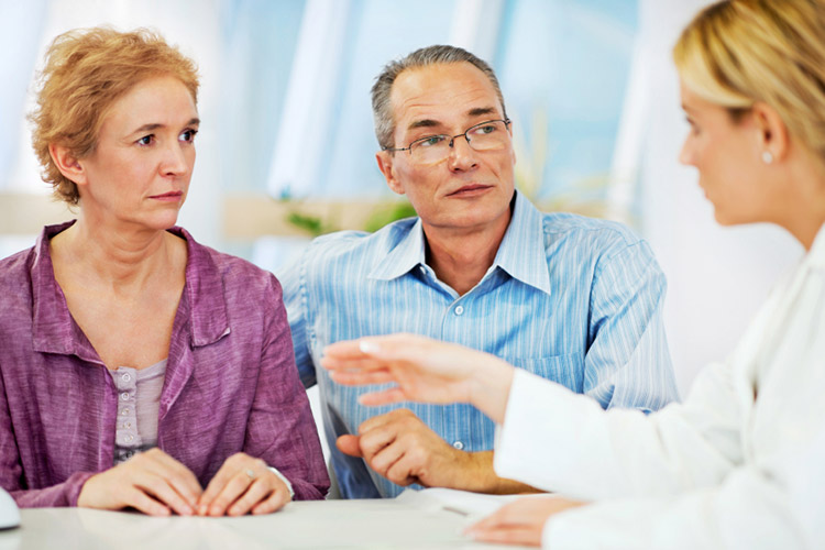 older couple talking with doctor