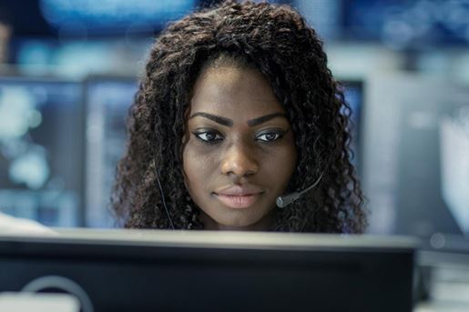 911 operator in front of computer screen