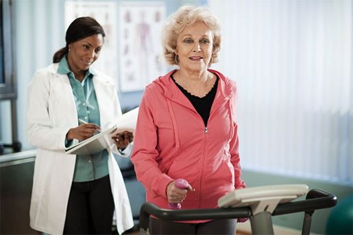 active senior woman exercising on treadmill