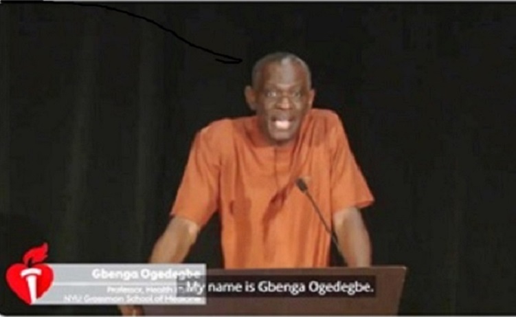 Dr. Ogedegbe standing behind a podium