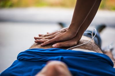 CPR compressions on man