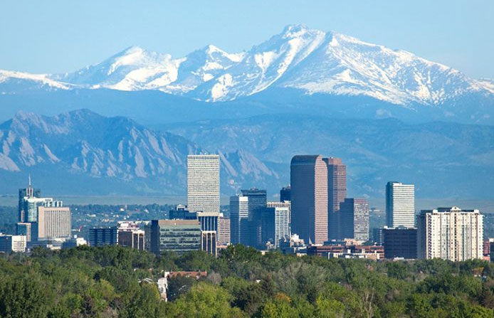 Denver Colorado skyline with mountains in background