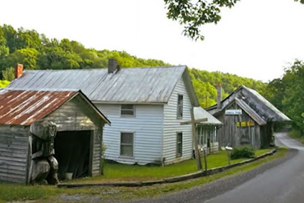 Photo of poorly maintained old home in the country.