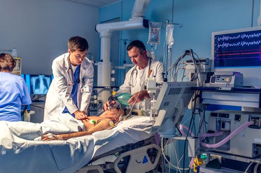 doctor doing CPR in emergency room