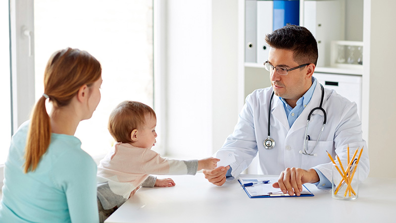 woman with baby and doctor at clinic woman with baby and doctor at clinic
