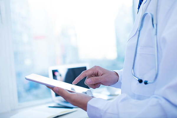 doctor with a tablet