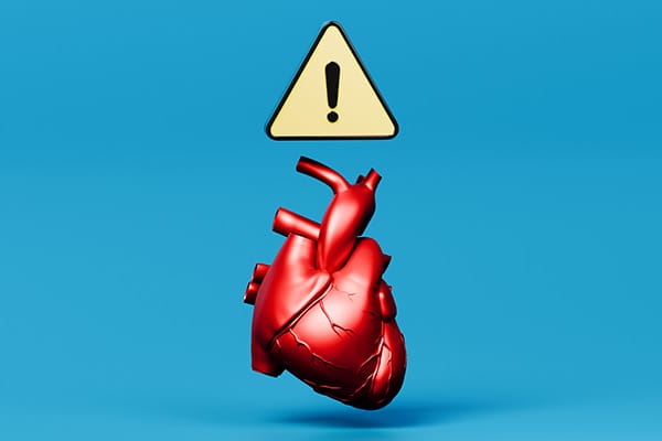  Floating Red Heart with Caution Symbol Highlighting Cardiovascular Risk