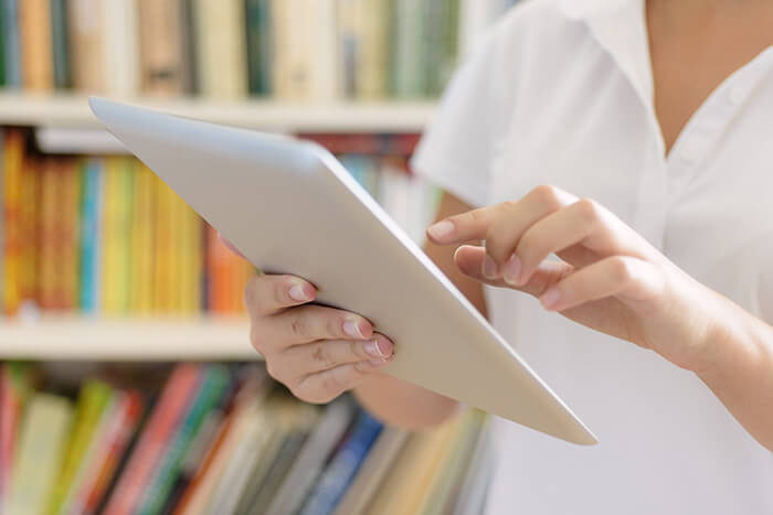 female hands using tablet computer
