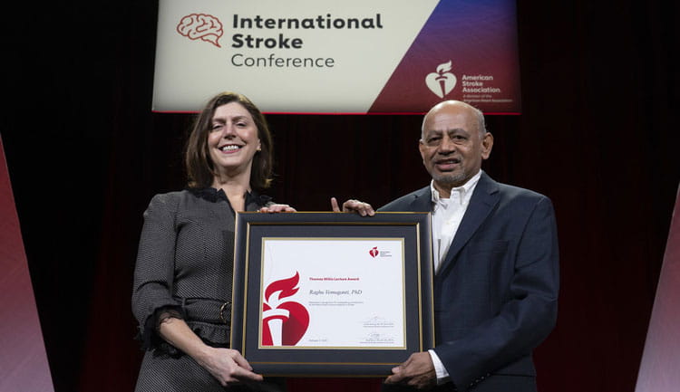 Raghu Vemuganti, MD poses with ISC Programming Chair Lauren Sansing, MD, MS, FAHA at #ISC25. Dr. Vemuganti was honored with the Thomas Willis Lecture.