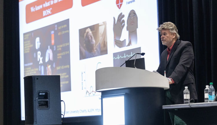 A speaker addresses the audience at Resuscitation Science Symposium 2025.