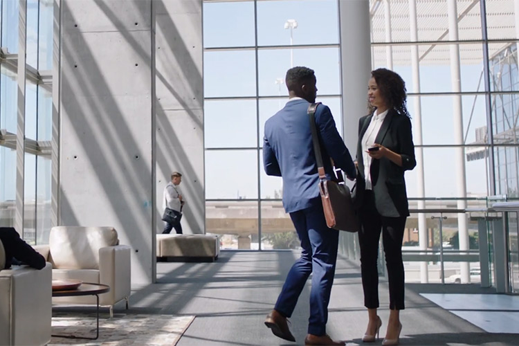 screen capture of two attendees greeting each other from the Scientific Sessions 2021 registration video.