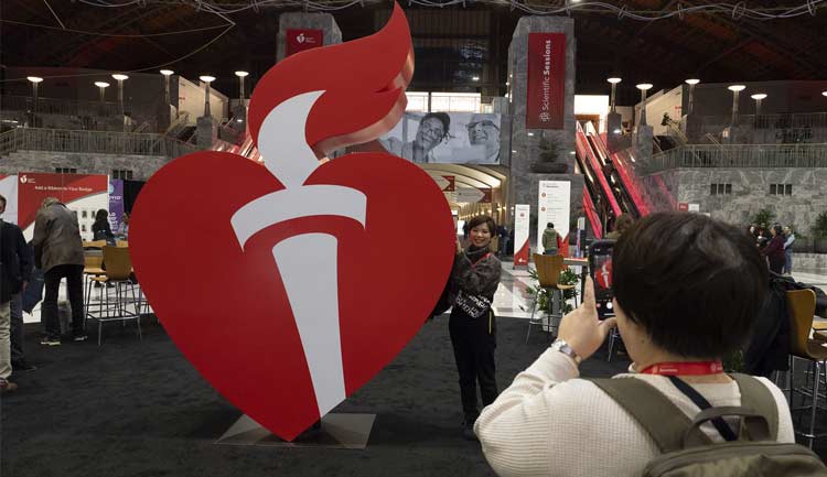 #AHA23 attendees pose with our 3D heart at Scientific Sessions 2023 in Philadelphia, PA