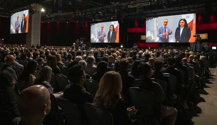 Audience members watch a video during the Featured Sessions at #AHA23 in Philadelphia, PA.