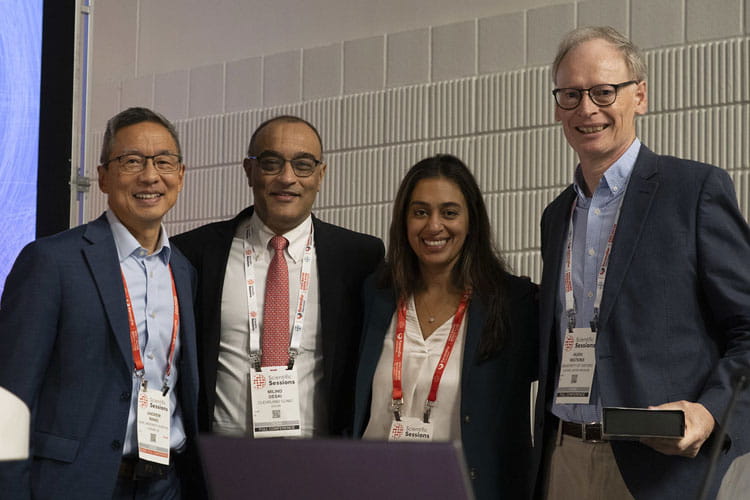 Organizers of HCMS 2025 stand with Hugh Watkins, right, at the start of the symposia. HCMS was co-located with #AHA25 for the first time this year.