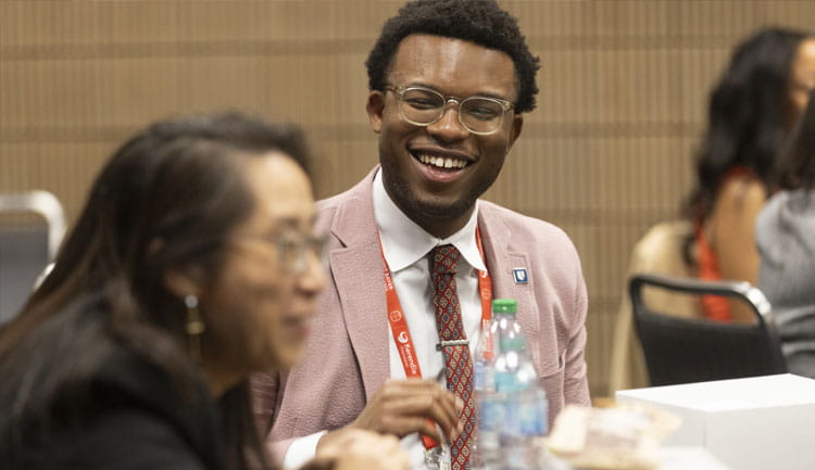 Attendees exchange a smile during the QCOR sessions during Scientific Sessions 2025.