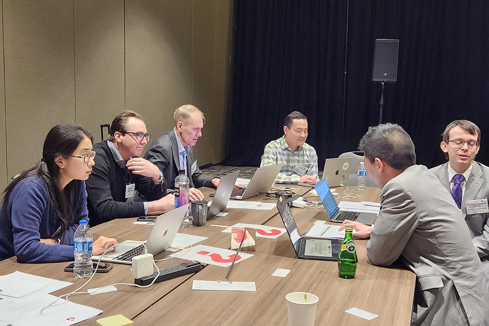 Group photo of table number 1 volunteers working to plan SS26 during this year's CSSP, February 2026.