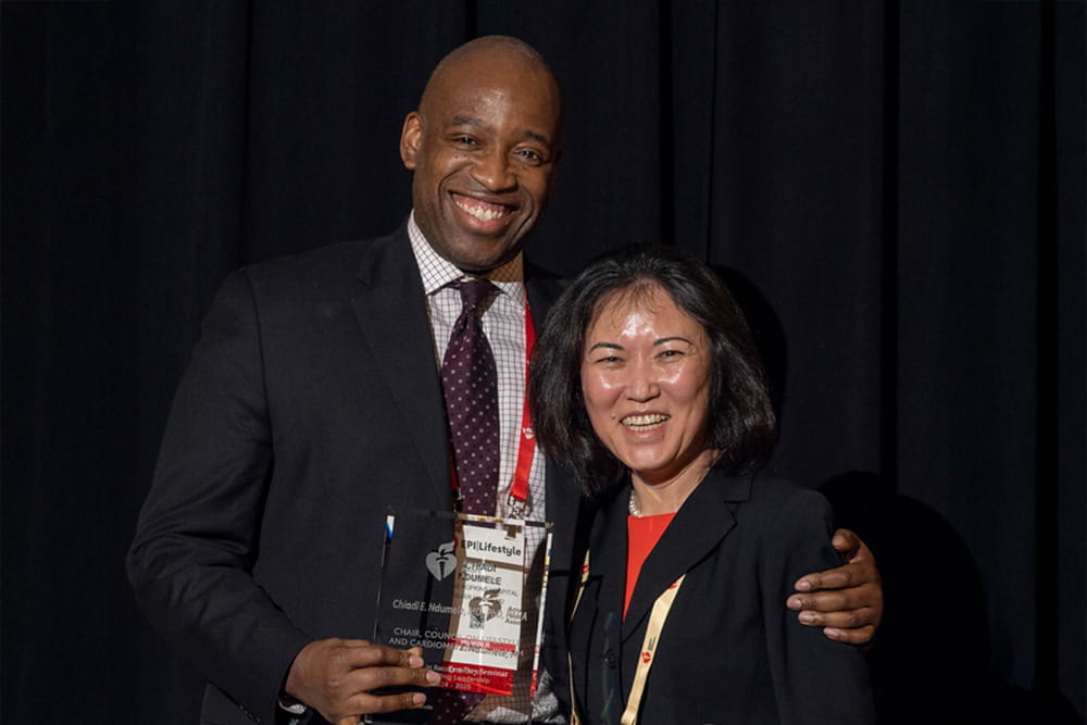 Chaidi E. Ndumele, MD, PhD, FAHA, receiving the Outstanding Leadership Award during EPI|Lifestyle26 in Boston, Massachusetts.